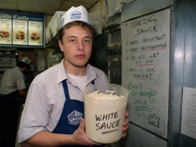 Elon Musk as a young White Castle worker holding a bucket labeled White Sauce for a satire story
