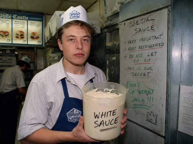 Elon Musk as a young White Castle worker holding a bucket labeled White Sauce for a satire story