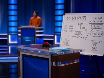 A blue-lit trivia game show podium with a contestant silhouette, math notes, and a scoreboard-style backdrop.